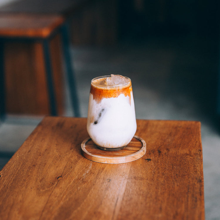 creamy-cold-drink-sits-on-a-wooden-table